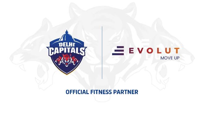 Delhi Capitals and Evolut logos announcing Evolut as Official Fitness Partner
